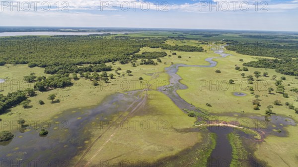Aerial view of typical Pantanal Wetlands landscape with lagoons, rivers, meadows and forests, cloudy sky, Mato Grosso, Brazil, South America