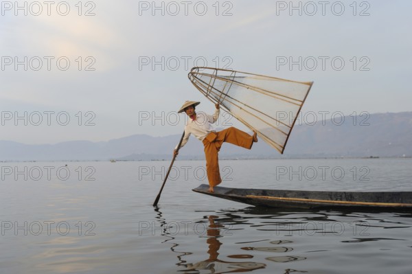 05.03.2014, Nyaung Shwe, Shan State, Myanmar, Asia, A one-legged rower fishes on the northern shore of Inle Lake. The lake is located in Shan State in the centre of Myanmar. The Inthas live on its shores and live mainly from fishing and farming, Asia