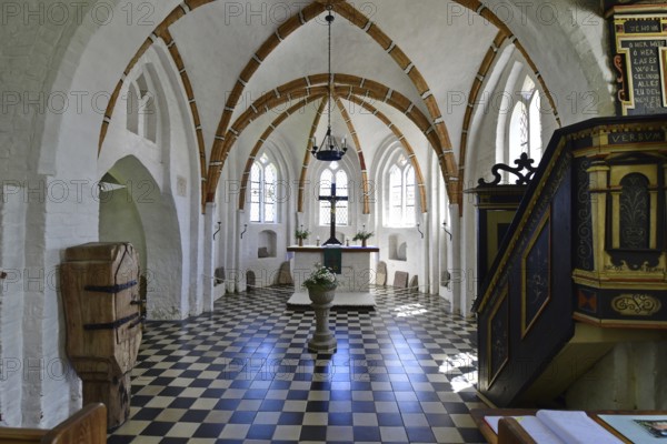 Historic church interior with pulpit and stained glass windows, suggesting silence and contemplation, Rügen (Groß Zicker)