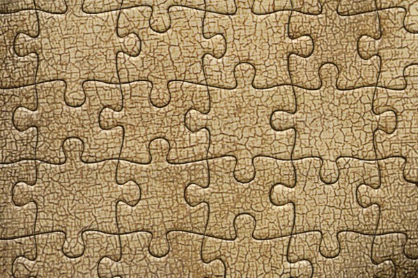 Background of cracked oil paint from a jigsaw