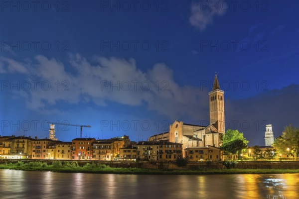 Verona Italy, night city skyline at Adige river and Basilica di Santa Anastasia