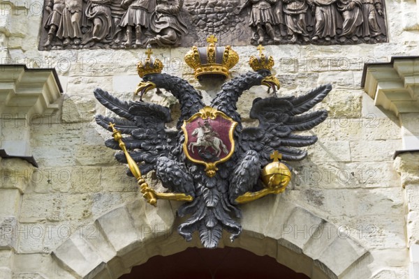 Saint Petersburg, Russia, June 12, 2019: Small State Coat of Arms of the Russian Empire on the wall above the gates of the Peter and Paul Fortress. Saint Petersburg, Russia, Europe