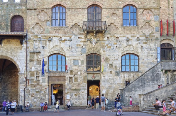 The fascinating facade of Palazzo Nuovo del Podesta on the Piazza del Duomo in San Gimignano, Tuscany, Italy, Europe