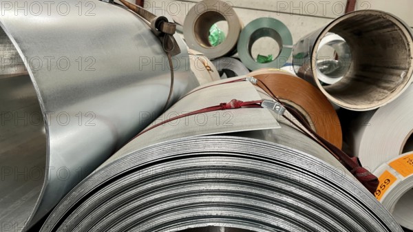 Rolls of galvanized steel sheet inside the factory or warehouse