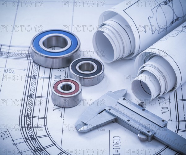 Close up image of construction drawings slide caliper rolling bearings on blueprint architecture and building concept