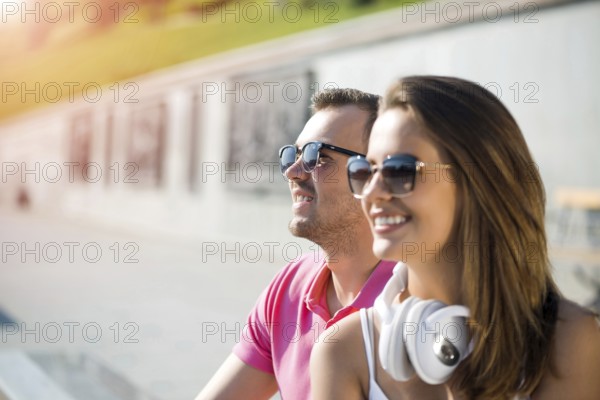 Young happy smiling couple having date outdoors
