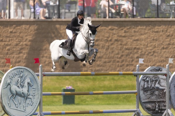 Carly Campbell-Cooper of Canada and riding Baretino, compete in the 1.60m Grand Prix during The Continental international competition at Spruce Meadows, in Calgary, Canada, North America