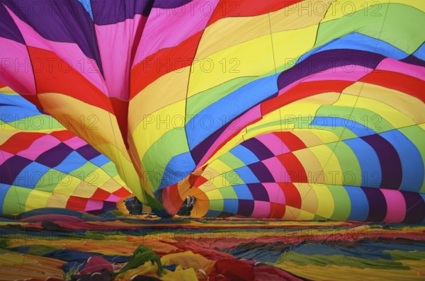 Hot air ballon being inflated on the ground