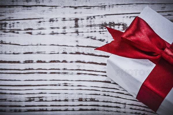 Present box on vintage wooden board holidays concept