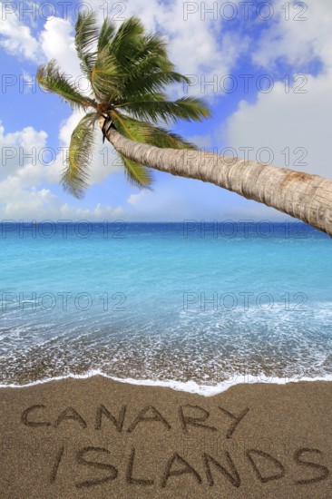 Brown beach sand with written word Canary islands