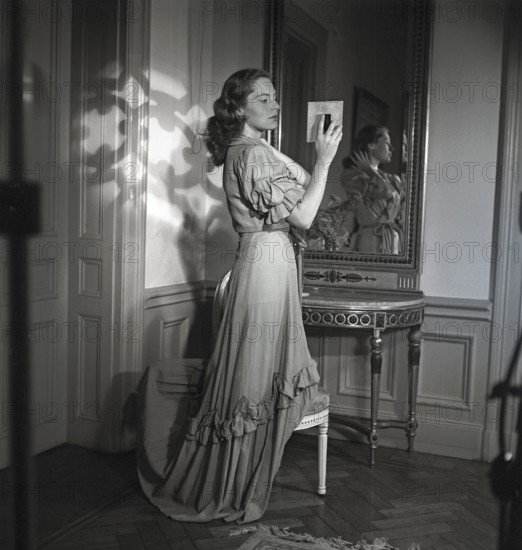Viveca Lindfors. Swedish-American Actress. 1920-1995. She is looking at herself in two mirrors to see how she looks from the side. Sweden 1944. Kristoffersson. ref K111-1