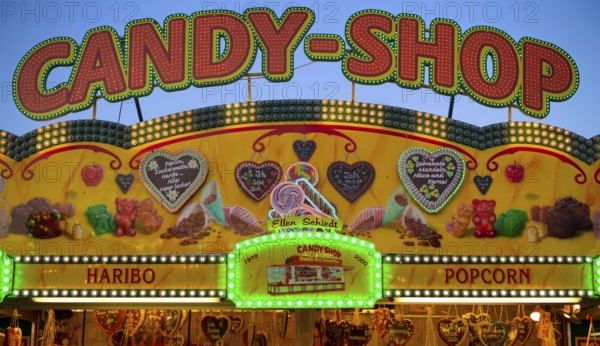 Sales stand, candy shop, confectionery, sweets, advertising, neon lighting, Cannstatter Wasen, folk festival, blue hour, Bad Cannstatt, Stuttgart, Baden-Württemberg, Germany, Europe