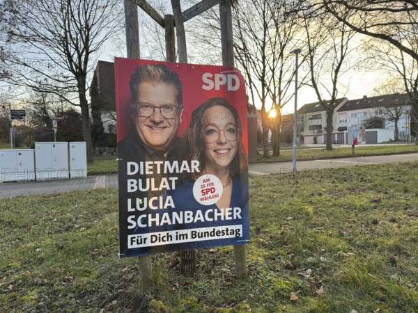 SPD election poster with two politicians, in the background a quiet city scene at sunset, election campaign, Bundestag elections 2025, Stuttgart, Bulat, Scharnbacher