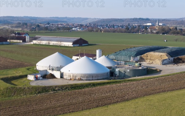 Green fields and a biogas plant in a quiet rural setting with a village, near Backnang, Rems-Murr-Kreis, Baden-Württemberg, Germany, Europe