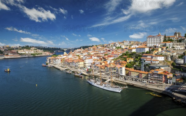 Aerial view of Porto city and Douro river with moored sailling ship from Dom Luis bridge I. Porto, Portugal, Europe
