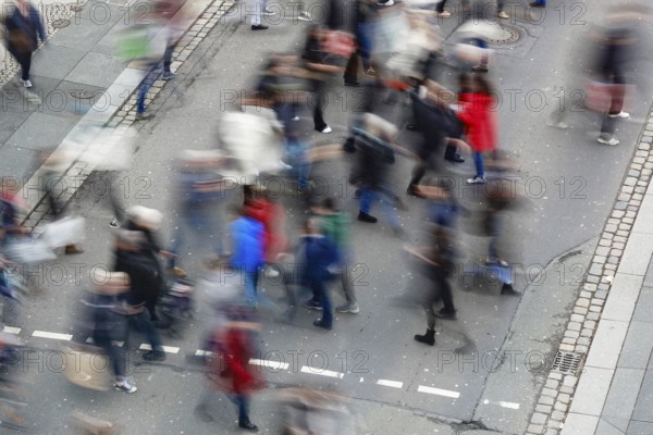 Passers-by crossing a street, long exposure, Germany, Europe
