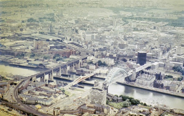Series of oblique aerial views of sites associated with Hadrian's Wall, c. 1970s three bridges over the River Tyne, Newcastle city centre, Northumberland, England, United Kingdom from the south-east