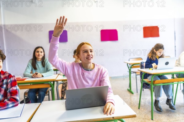 Smart student raises her hand to ask a question during class, showing engagement and participation in modern education