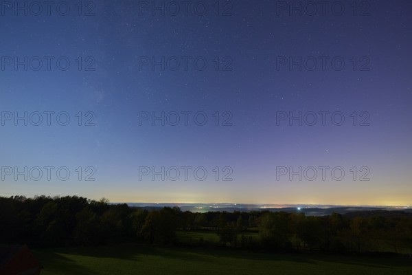 Nocturnal landscape with starry sky over a quiet, rural area, Dammbach, Spessart, Bavaria, Germany, Europe