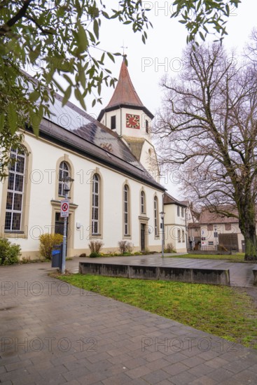 Old church surrounded by trees, well-kept pavement in the foreground, quiet atmosphere, Großbottwar, Ludwigsburg district, Baden-Württemberg, Germany, Europe