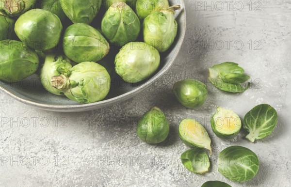Fresh Brussels sprouts, raw, top view, on a gray table, no people