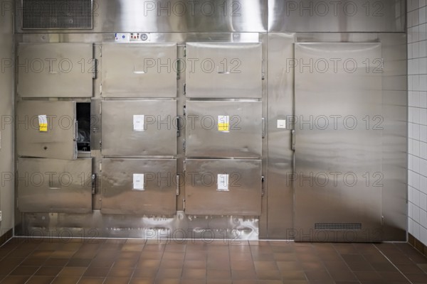 Hospital, morgue, pathology, cold room with metal doors and sterile-looking surroundings, tiled walls and floor, Germany, Europe