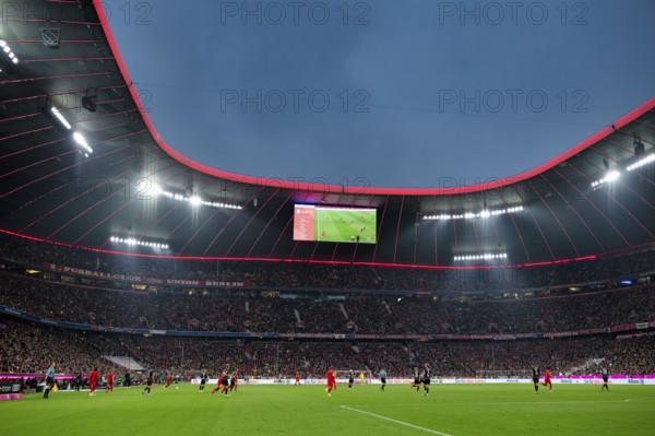 Overview, Allianz Arena illuminated, scoreboard, football, Bundesliga, FC Bayern Munich FCB versus 1. FC Union Berlin FCU, blue hour, Allianz Arena, Munich, Bavaria, Germany, Europe