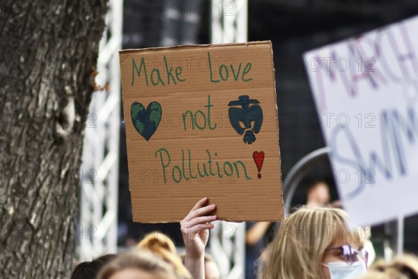 Heidelberg, Germany, 24th September 2021: Sign held up by young woman saying 'Not cool' at Global Climate Strike demonstration, Europe