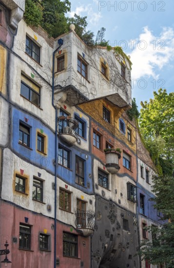 Colorful Facade of Hundertwasserhaus, apartment house designed by Friedensreich Hundertwasser in Vienna, Wien, Austria, Europe