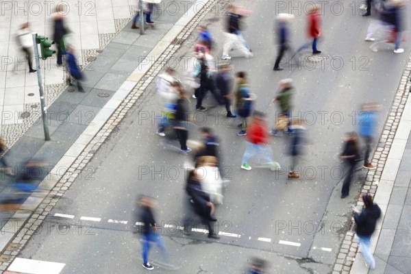 Passers-by crossing a street, long exposure, Germany, Europe