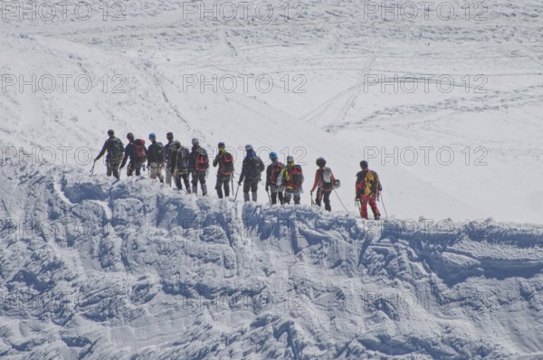 Rope team on the glacier of Mont Blanc (4805 m) . in the Savoy Alps, in the department of Haute-Savoie in the Auvergne-Rhône-Alpes region, France, Europe