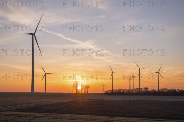 Wind turbines in an open landscape at sunset, near Ulm, Swabian Alb, Baden-Württemberg, Germany, Europe