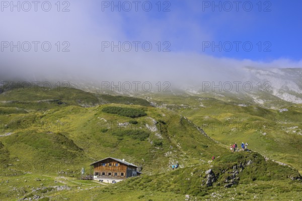 Giglachseehütte and fog over the mountain ridge, Schladming, Styria, Austria, Europe