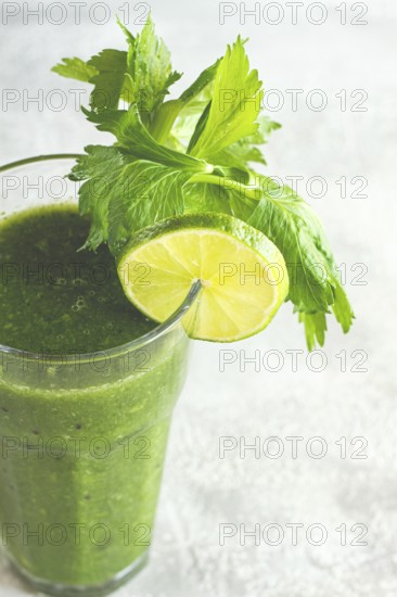 Glass with green smoothie, celery and spinach, apple and kiwi, cucumber, vegetable smoothie, breakfast, homemade, no people