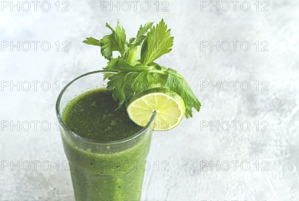 Glass with green smoothie, celery and spinach, apple and kiwi, cucumber, vegetable smoothie, breakfast, homemade, no people