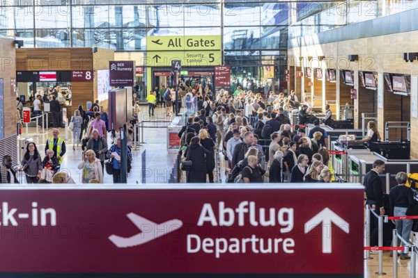Berlin-Brandenburg BER Airport. Passengers in Terminal 1 waiting for check-in and security control in front of departure. Berlin, Germany, Europe