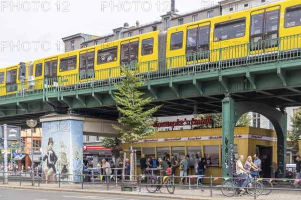 Konnopke's snack bar is cult. Konnopke's in Prenzlauer Berg. It was the first snack bar in East Berlin to introduce the currywurst in 1960. Underground as an above-ground elevated railway on a viaduct. Berlin, Germany, Europe
