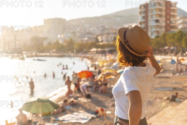 Portrait of a tourist woman at sunset in Sarande or Saranda on the Albanian riviera, Albania, Europe