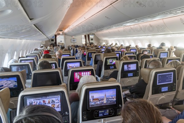 Etihad airline aircraft, interior, rows of seats with passengers. Boeing 787 aircraft on a flight to Munich. Abu Dhabi, United Arab Emirates, UAE, Asia