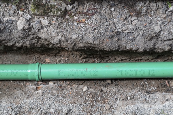 Newly laid green sewage pipe in a trench, Stuttgart, Baden-Württemberg