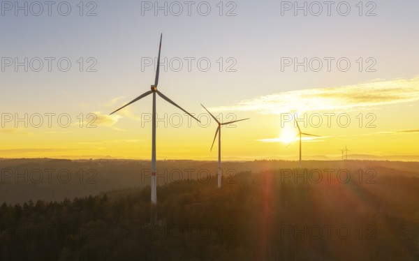Wind turbines on hills at sunrise, natural landscape in orange and blue sky, wind farm, Rems Valley, Baden-Württemberg, Germany, Europe
