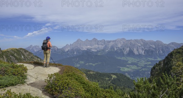 Woman looking towards the Dachstein massif, Schladming, Styria, Austria, Europe