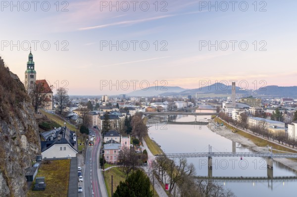 View of the Mülln parish church, Salzach with Müllnersteg, sunset, Salzburg City, Salzburg