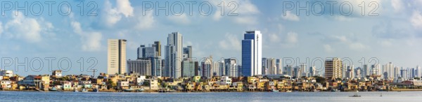 Panoramic image of the city of Recife in Pernambuco with the river and the favela in the foreground and the buildings behind, Recife, Pernambuco, Brazil, South America
