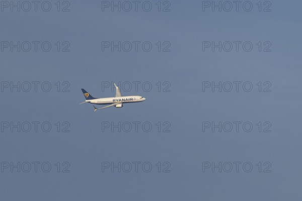 Boeing 737 jet passenger aircraft of Ryanair flying in a blue sky, Rome, Italy, Europe