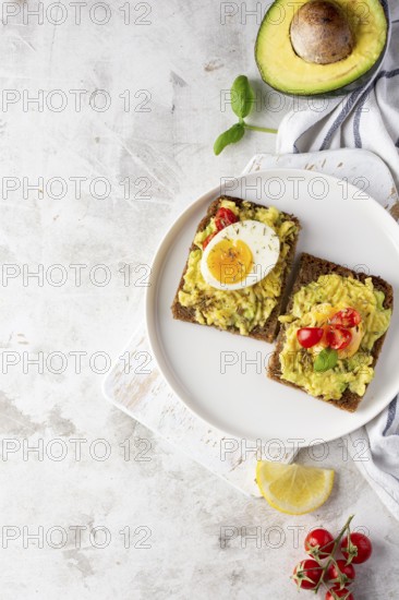 Delicious toast with veggie cream half avocado