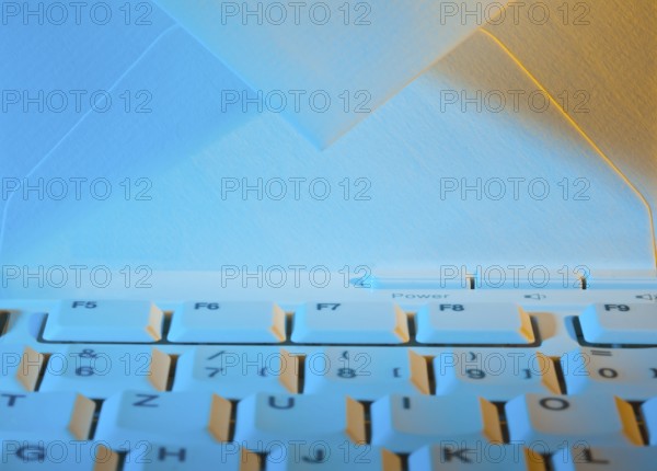 The keyboard of a computer and an envelope. Communication via e-mail, The keyboard of a computer and an envelope. Communication via e-mail. Austria