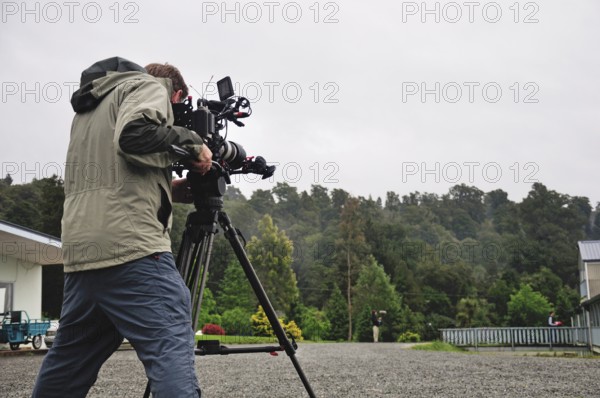 Cameraman at work in a housing area