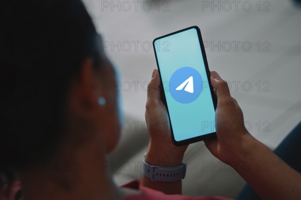 In this photo illustration, the Telegram logo is displayed on a smartphone screen