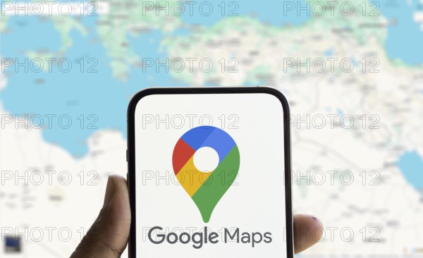 Google maps logo is displayed on smartphone